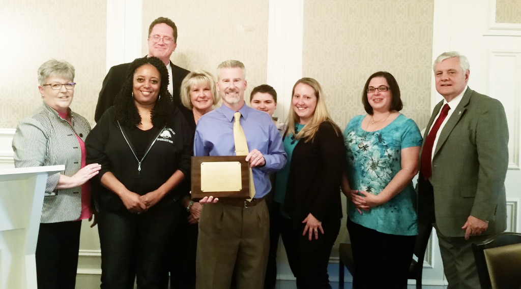 At a recent meeting of the Atlantic County School Boards Association, the Hamilton Township (Atlantic County) board was presented with board recertification. Pictured, L to R, are NJSBA field service representative Mary Ann Friedman; Hamilton Township board members ………; and NJSBA President Donald Webster Jr.
