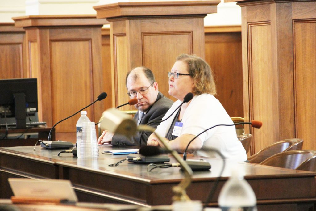 Eileen Miller (at microphone) of the Woodstown-Pilesgrove Regional Board of Education testified before the Senate Education Committee on May 18 in support of bill S-3191, which would extend the voting rights of representatives of sending districts on receiving district boards of education. The bill passed the committee by a 4-0 margin. At her right is John Burns, NJSBA counsel. 