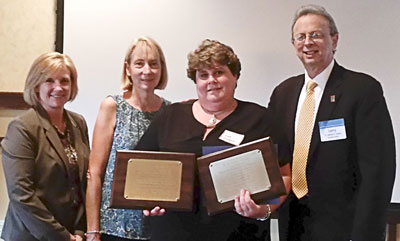 Lisa Marshall of the Warren Hills Regional Board of Education received three NJSBA Board Member Academy certifications: Certificated Board Member, Master Board Member and Certified Board Leader. She earned the credits for all three awards during her first term as a board member, and was awarded the certifications simultaneously after entering her second term. Shown here in a 2016 photograph, left to right, Robynn Meehan, NJSBA field service representative; Karen Graf, Warren County School Boards Association president; Lisa Marshall; and Dr. Lawrence S. Feinsod, NJSBA executive director.