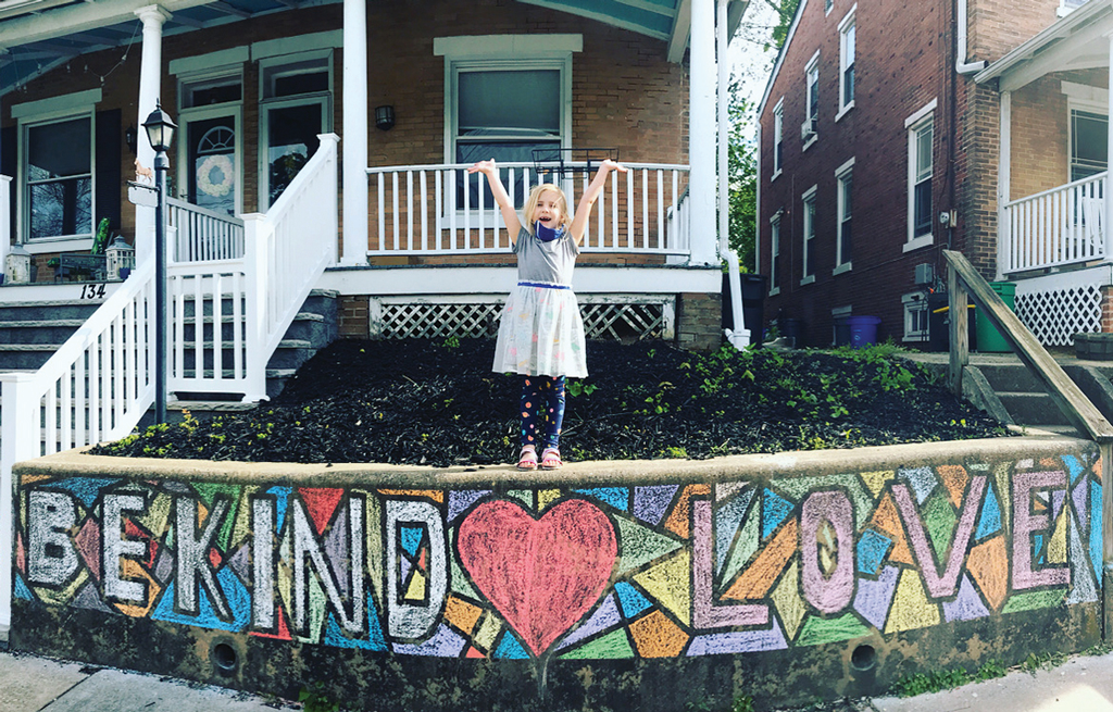 Spreading Love in Haddonfield: As part of an elementary school principal’s challenge to draw something that depicts “love,” one first-grader in Haddonfield shows off a chalk drawing in front of her house.