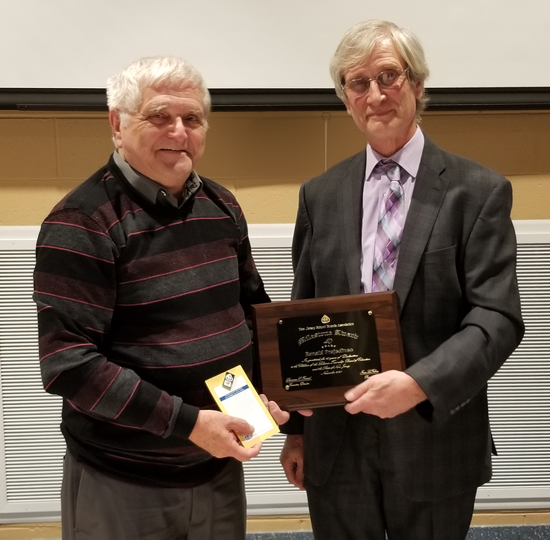 Richard Morris (left) is recognized for 40 years of service on the Alloway Township Board of Education at the Salem/Cumberland County School Boards Associations meeting Nov. 17. Ray Pinney, (right) director of county activities and member engagement at NJSBA, presented Morris with a plaque recognizing his dedicated service.