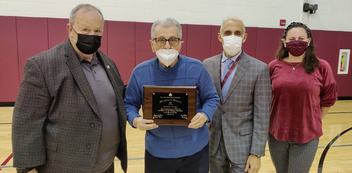 Richard Vartan, who has served on the East Rutherford Board of Education in Bergen County for 33 years, was honored with a plaque marking his long tenure at the board’s Jan. 4 meeting. Pictured left to right: Bruce Young, vice president for county activities of the New Jersey School Boards Association; Richard Vartan; Giovanni Giancaspro, superintendent of the East Rutherford School District; and Erin Shemeley, president of the East Rutherford Board of Education.
