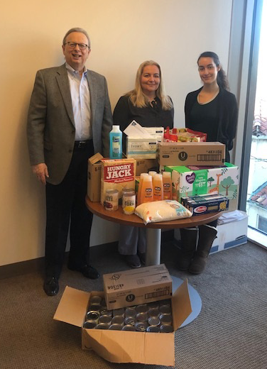 Left to right: Dr. Lawrence S. Feinsod, executive director of the New Jersey School Boards Association, with Maja Klysinski, director of human resources at NJSBA; and Jocelyn Merker, coordinator, human resources and finance at NJSBA, with some of the items NJSBA staff have donated to support Ukrainians in need.