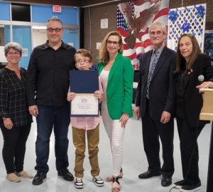 Pictured left to right are Robin Kampf, NJSBA digital media producer; Dylan’s father Kevin Visioli; Dylan; Dylan’s mom Anna Visioli; Ray Pinney, NJSBA director of county activities and member engagement; and Bernadette Dalesandro, president of the Morris County School Boards Association. 