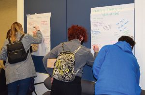 New Jersey Future Educators Association members leaving positive feedback for breakout session presenters at a conference at The College of New Jersey in January 2023.