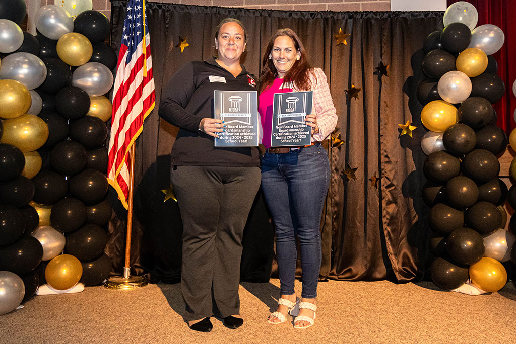 group of people posing with awards