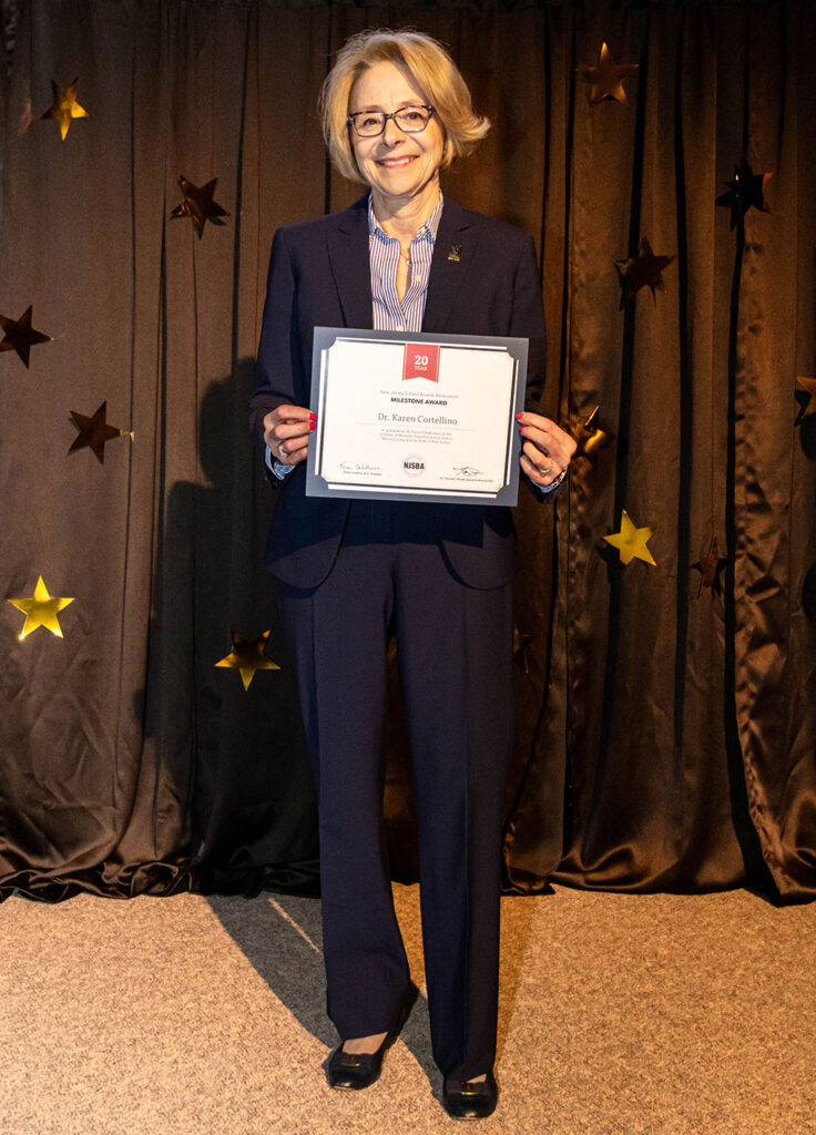 person posing with an award