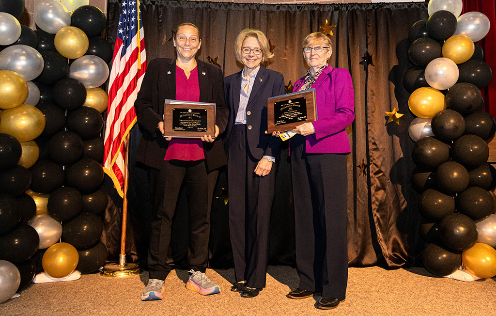 group of people posing with awards