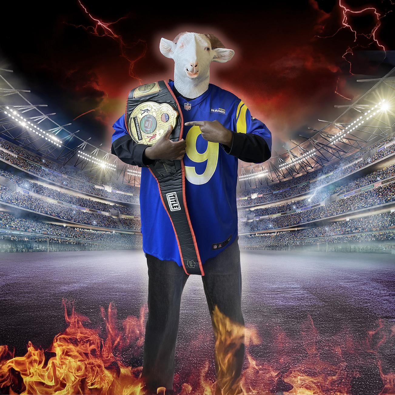 Daniel in a football stadium with a sheep mask on and a champion belt.