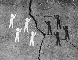 image of cracked concrete with white figures on one side and black on the other