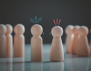 wooden peg figures depicting a fight