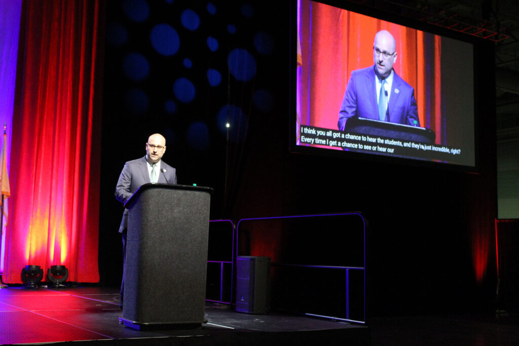 Commissioner of Education Kevin Dehmer giving a keynote address at workshop 2025