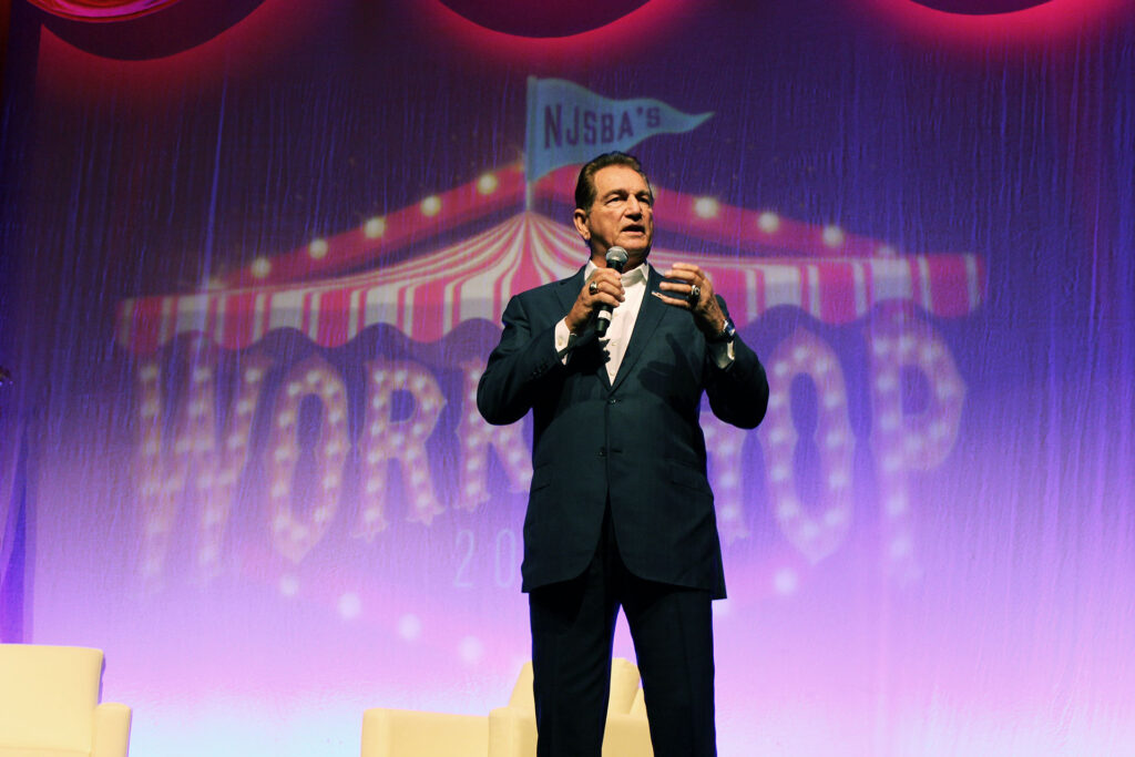 closeup of Joe Theismann giving a keynote address at workshop 2025