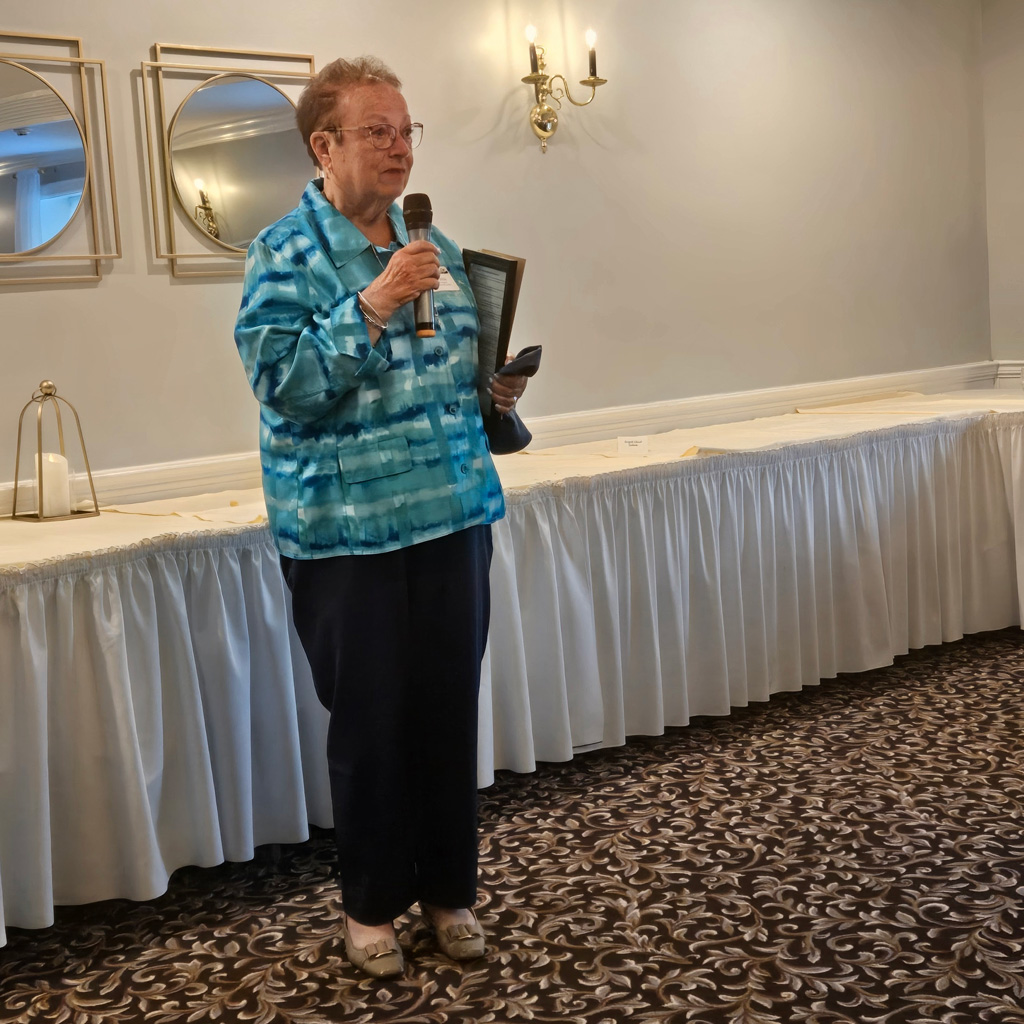 Woman speaking with a microphone
