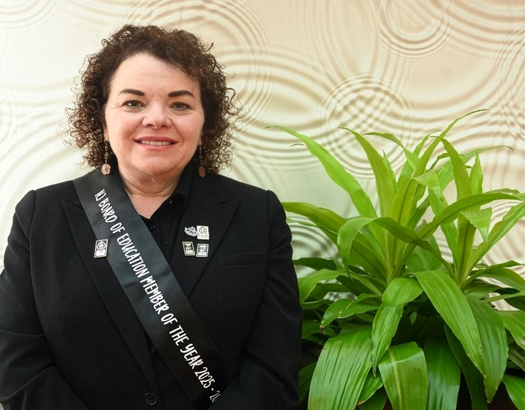 Dana Krug poses wearing a NJ Board o Education member of the Year 2025 sash.